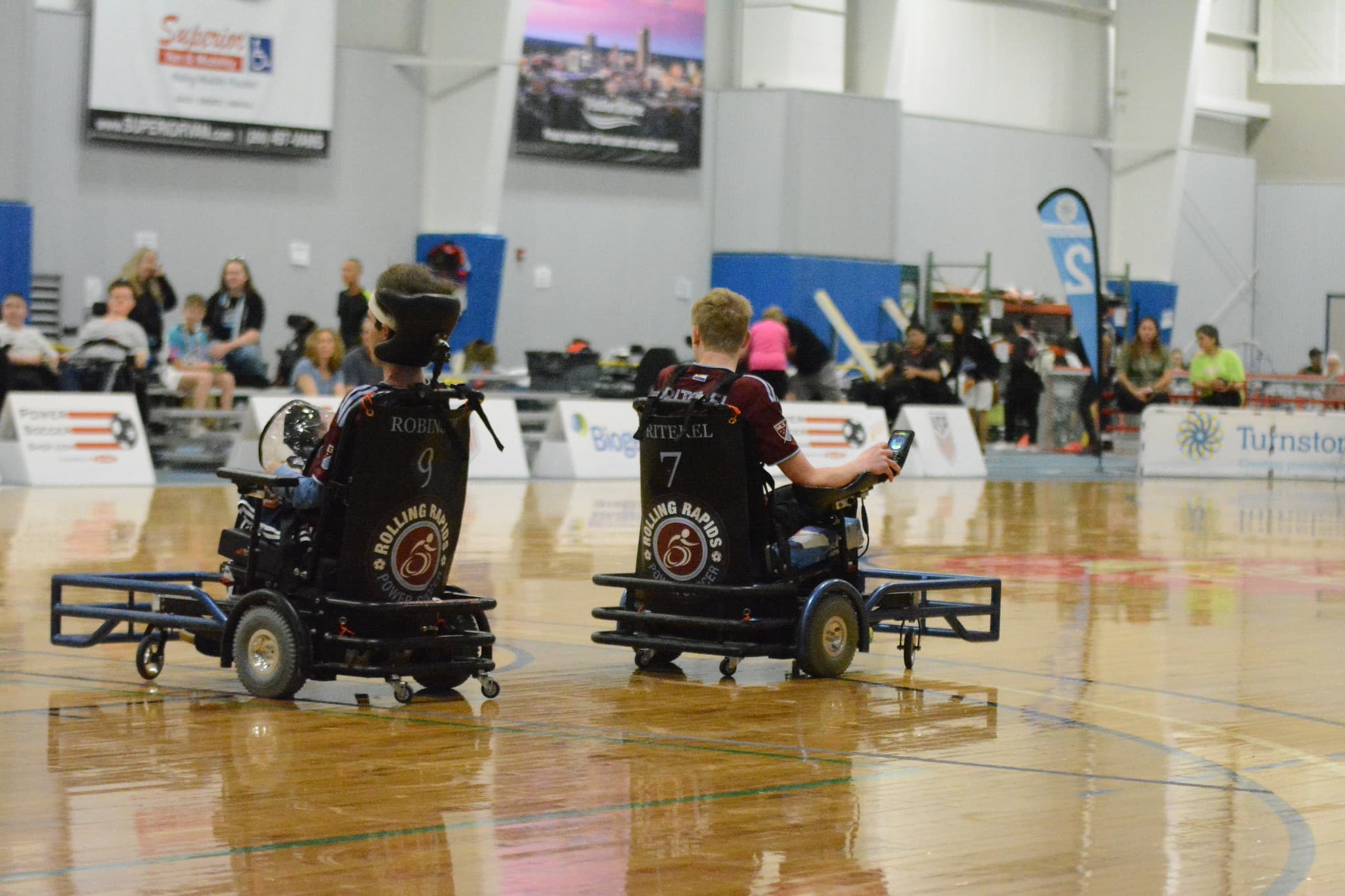 Bjorn Robinson and teammates in Rolling Rapids power chairs