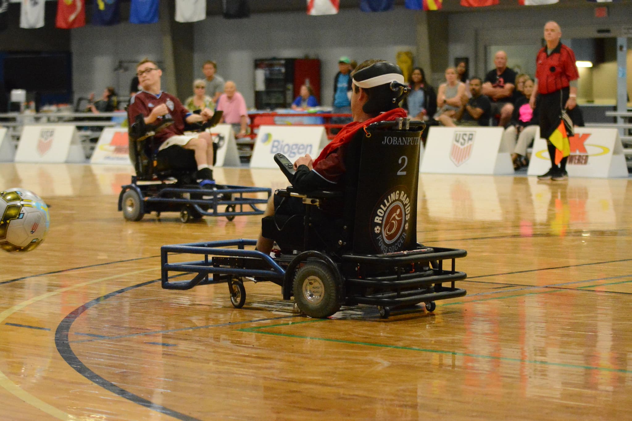 Jack Jobanputra chasing the ball in Rolling Rapids chair