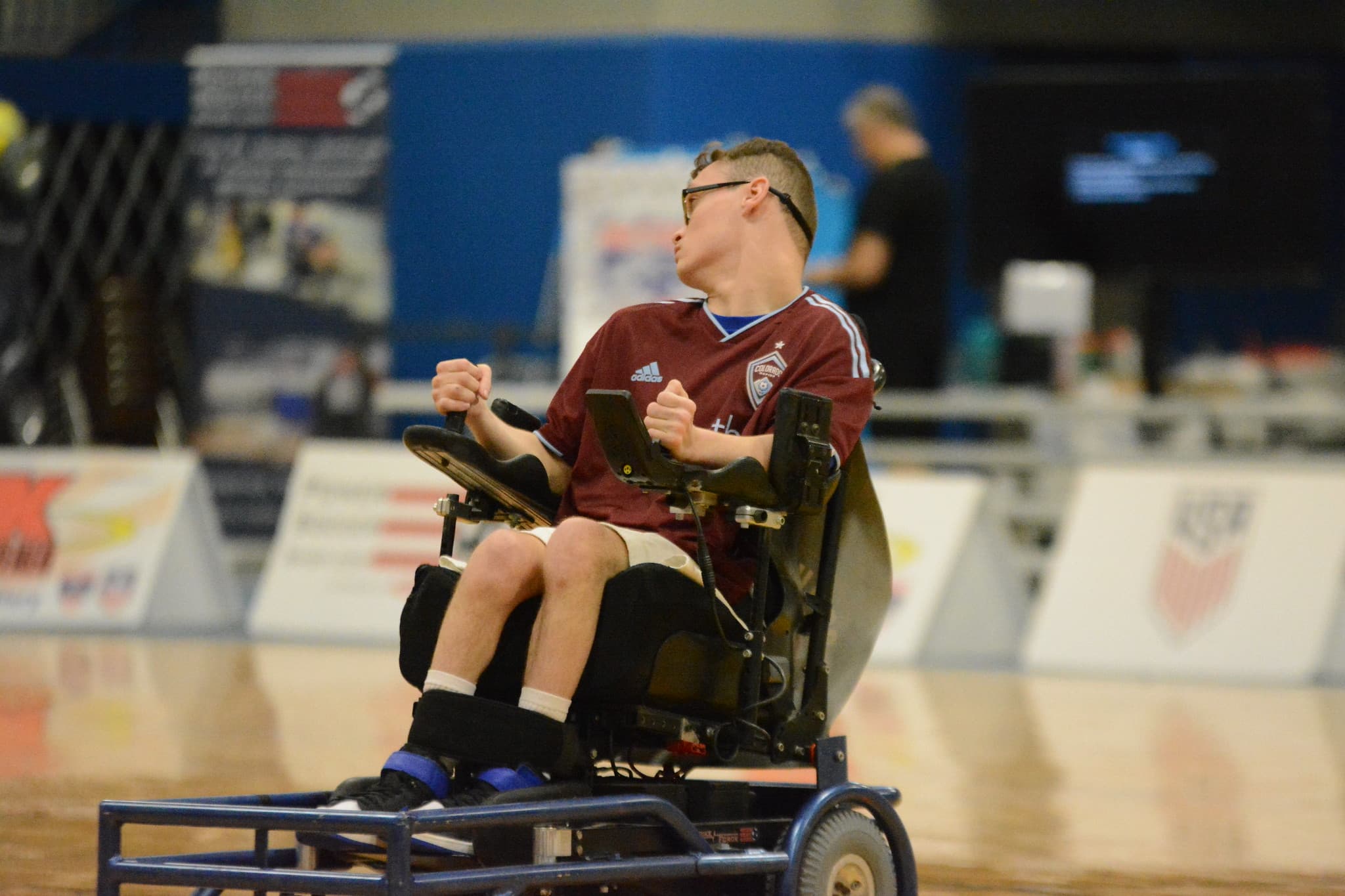 Rolling Rapids athlete competing in burgundy Rapids jersey