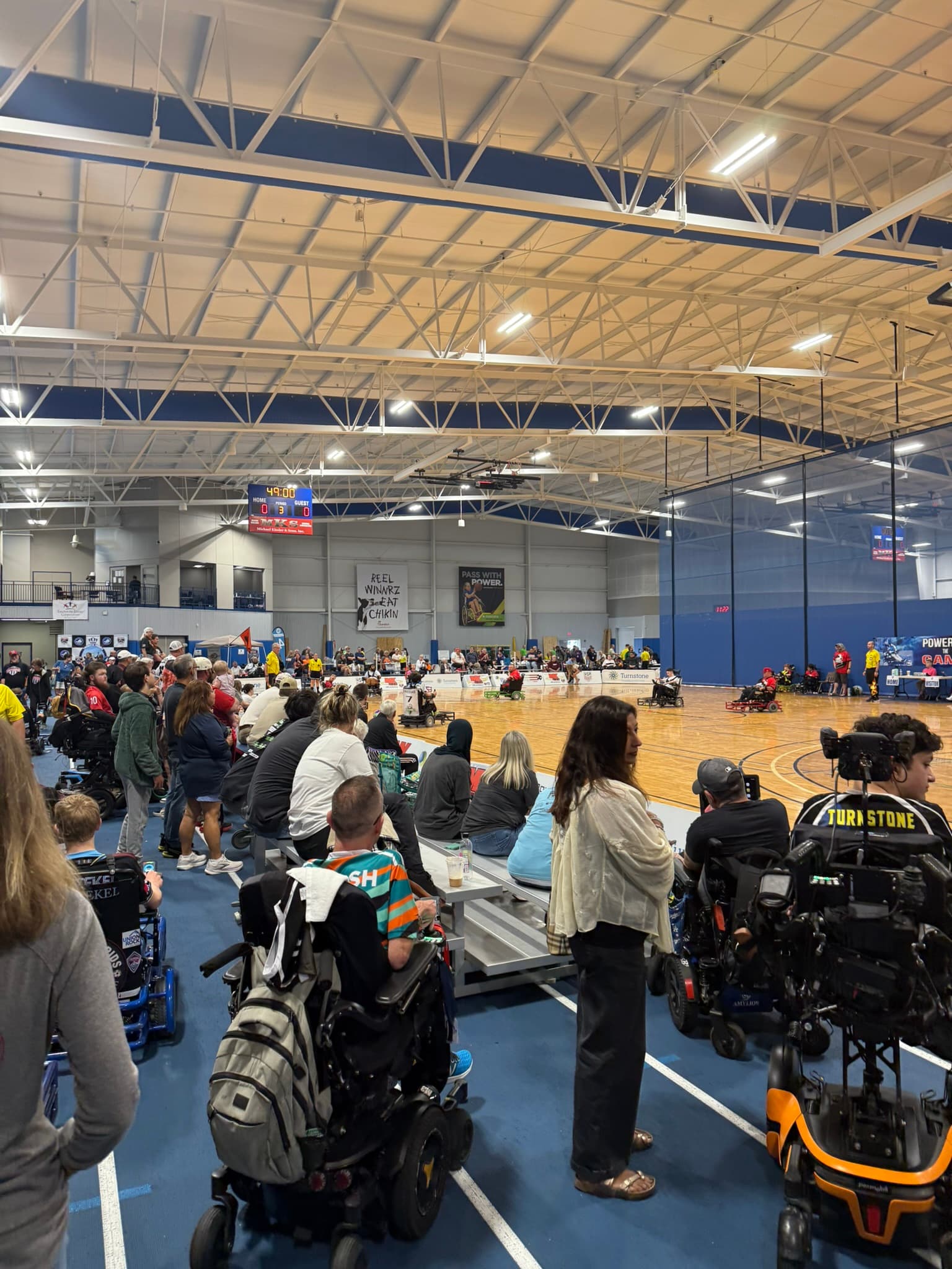 Crowd and players at a national power soccer tournament