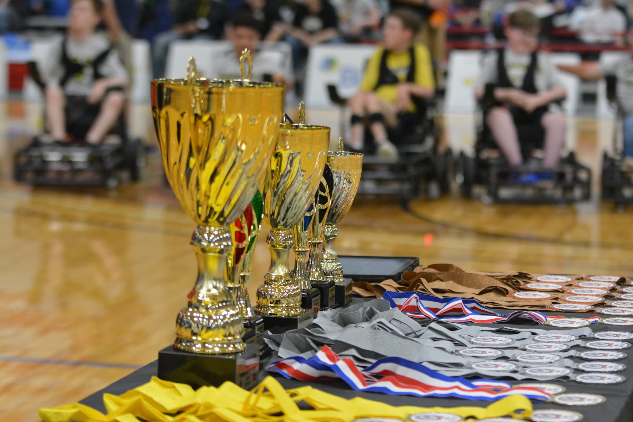 Trophies and medals at a power soccer tournament